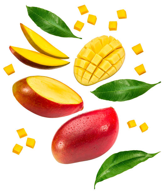 istock flying sliced mango with green leaves isolated on white background. exotic fruit. clipping path 1814907456
