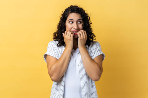 istock Woman biting her nails, worrying about problems, bad habit due to stress and depression. 1814908007