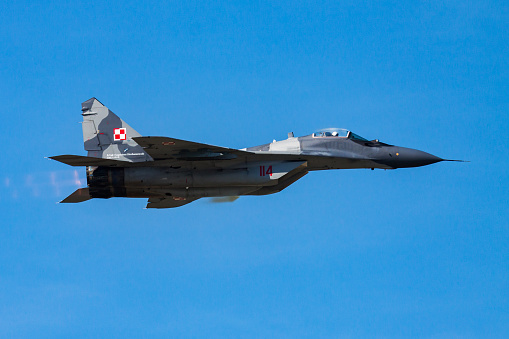 Hillsboro, Oregon, USA - May 22, 2022 : A low fly-by of an Oregon Air National Guard USAF F-15C Eagle. The Air Show in Hillsboro, Oregon is a very popular event each year. The theme for 2022 was “She Flies with her own wings.” All performers, pilots and announcers were women. Hillsboro is a suburb of the city of Portland, Oregon.