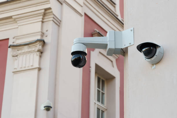 istock Surveillance cameras installed on the wall of an old building. 1814918076