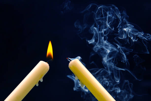 Igniting matches from a candle fire. Sulfur ignition close up. Macro shooting.