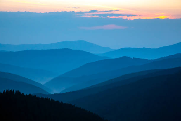 istock Morning fog in a mountain valley area 1814941690