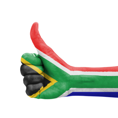 Hand with thumb up, South Africa flag painted as symbol of excellence, achievement, good - isolated on white background