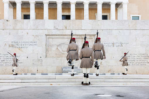 Athens, Greece - October 13, 2023:  Changing of the presidential guard (Evzones) on Syntagma Square in the center of Athens, (Greece) opposite the tomb of the Unknown Soldier and Parliament building.