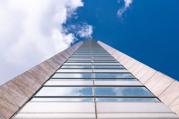 istock underside panoramic and perspective view to steel blue glass high rise building skyscrapers, business concept of successful industrial architecture 1814963426