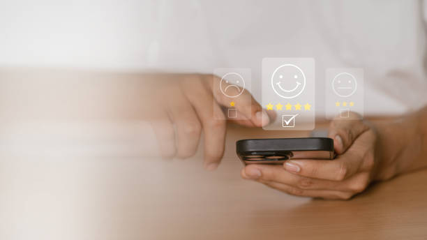 istock User give five star rating using a smartphone on the online application for the customer review satisfaction feedback survey idea, users rate their service experience 1814968232