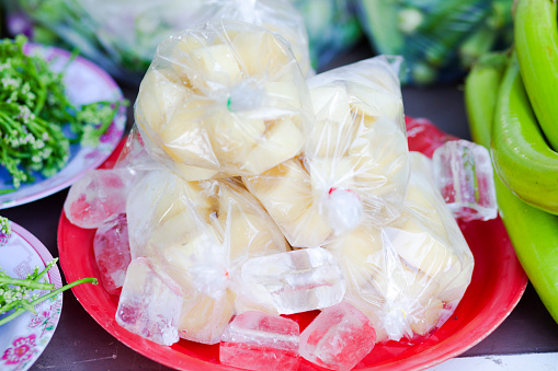 Plastic bags thai vegetable on ice at market stall in Chiang Rai province