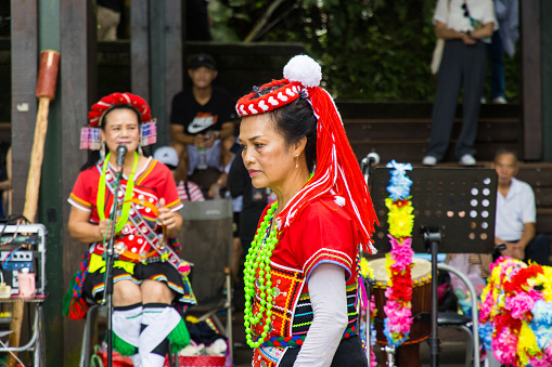 Sun Moon Lake,  Yuchi,  Taiwan - October 9, 2023: Taiwanese indigenous Thao Street Singers and Bands performing in Xuanguang Temple with traditional dress