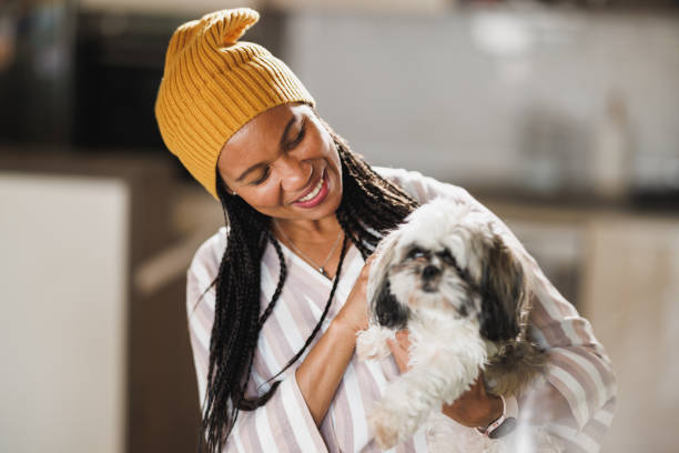 istock Black Woman With Her Small Pet Dog 1815002264