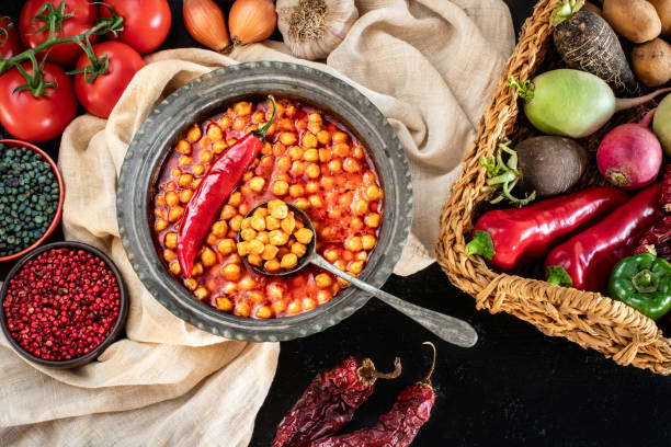istock Chichpea dish with tomato sauce on the table. 1815007102