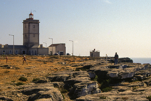 Cabo Carvoeiro, Portugal - aug 9, 1993: view of the historic Cape Carvoeiro lighthouse, overlooking the Atlantic Ocean, in Portugal