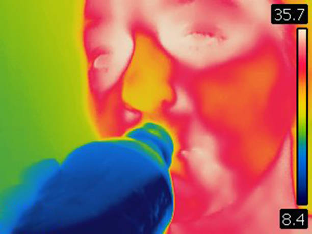 istock Thermal image of woman drinking cold water from a bottle 1815021999