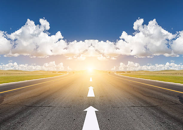 Country Highway Road Running Through Fields. panoramic country road single lane road sky stock pictures, royalty-free photos & images