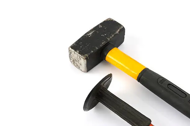 Hammer and chisel on a white background.