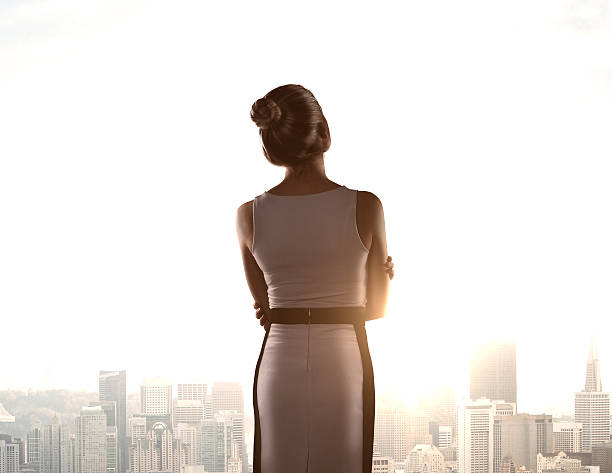 istock woman standing in office 181506704