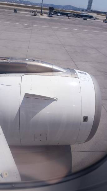 istock A view of a jet engine and plane winbg from the plane window. 1815068819