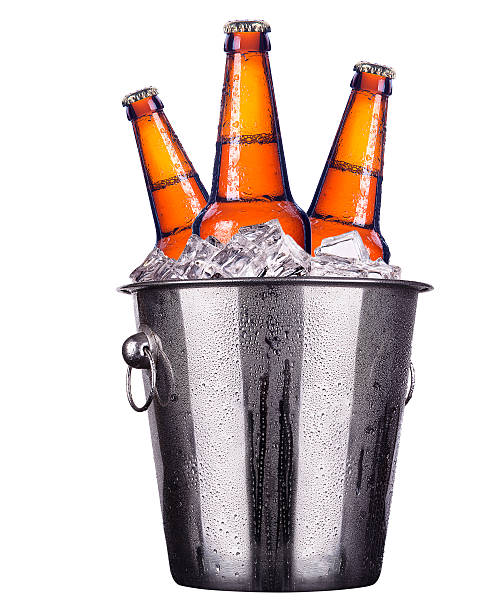 Beer bottles in ice bucket isolated stock photo