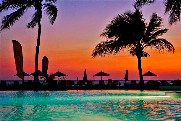 parasol lagoon and coast swimming pool sunset parasol lagoon and coastline in madagascar nosy be madagascar beach photos stock pictures, royalty-free photos & images