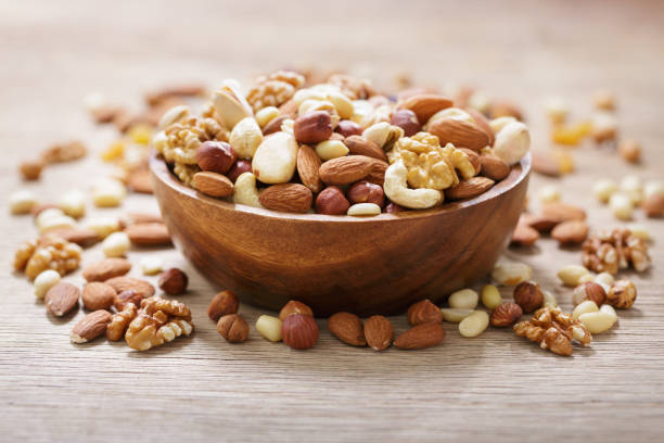 istock bowl of mixed nuts on wooden table 1815090403