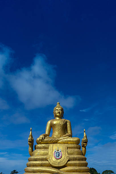 Gold Buddha statue at Chalong in Phuket.