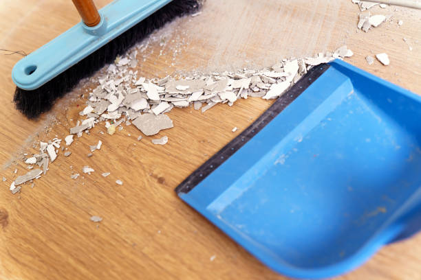 istock Cleaning loose plaster with a brush and dustpan 1815105929