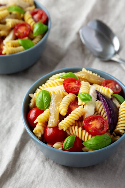 istock Homemade Fusilli Pasta Salad with Mozzarella and Vegetables, side view. 1815106335