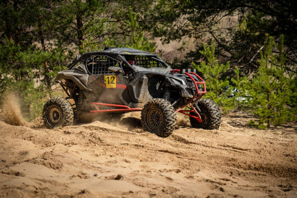 istock UTV, ATV, 4x4 off road vehicle in sandy open area. Buggy extreme riding 1815117958