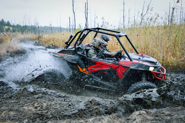 istock Offroad extreme vehicle racing with mud splash. ATV, buggy, quad, UTV, 4x4 1815120348