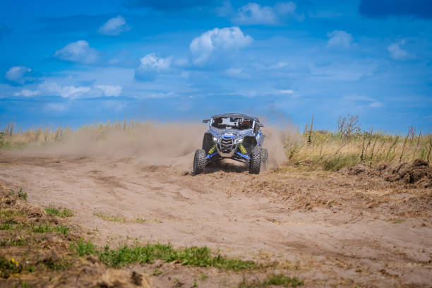 istock UTV in action offroad vehicle racing on sand dune. Extreme, adrenalin. 4x4. 1815120349