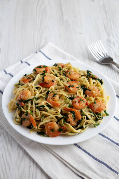 istock Homemade One-Pot Lemon Garlic Shrimp Pasta on a Plate, side view. 1815141049