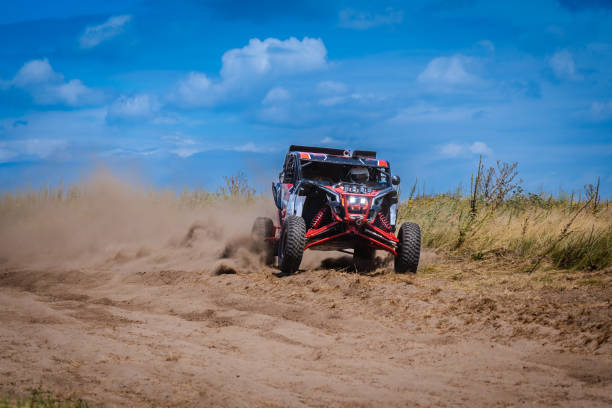 istock UTV buggy and 4x4 offroad in sandy track. Rally extreme riding 1815157031