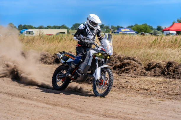 istock Motocross rider riding on extreme dust track 1815157545