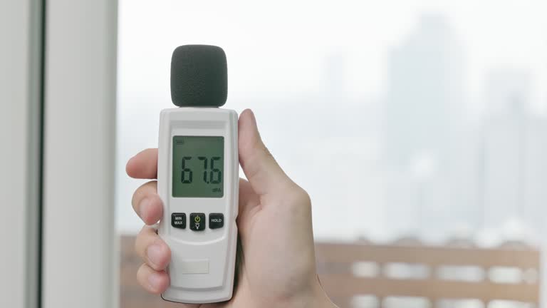 man use sound level meter