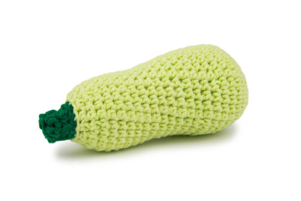 istock Artificial zucchini with green handles, knitted from thick yarn 1815163432