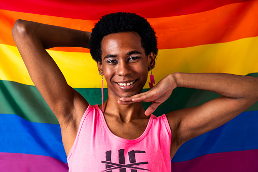 Fluid gender hispanic latin black man posing in studio with fashionable clothing, concepts about LGBTQ, genderless and diversity