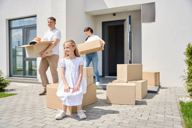 istock Girl sits on a box in the yard 1815168695
