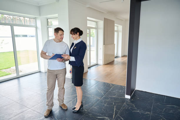 istock Man signs documents for buying a house 1815168705