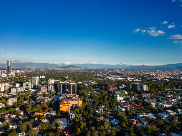 istock Cityscape with snowcapped volcanoes 1815174090