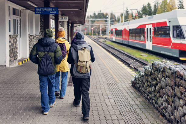 Family walking in the Štrbské Pleso train station Family walking in the Štrbské Pleso train station.
Shot with Canon R5 high tatras stock pictures, royalty-free photos & images