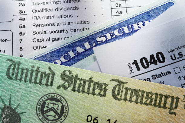 u.s. treasury check social security card and tax return - tax form treasury check tax imagens e fotografias de stock