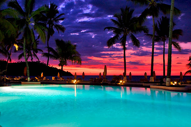 istock swimming pool sunset parasol   in nosy be 181520787