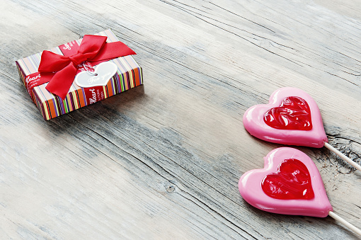 concept of Valentine's Day is a heart-shaped sugar candy with a gift box. gift and congratulations on Valentine's Day. copy space.