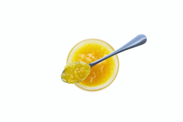 istock Top view of lemon jam in jar with spoon isolated on white background. 1815245524