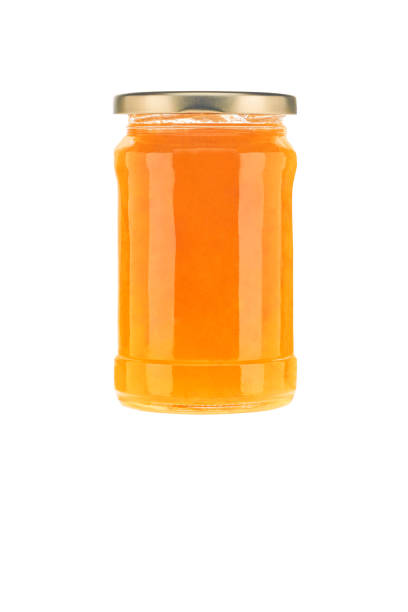 istock Jar of orange jam isolated on white background. 1815245528