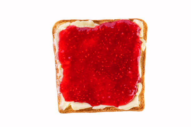 istock Toast with raspberry jam and butter isolated on white background, top view. 1815245546