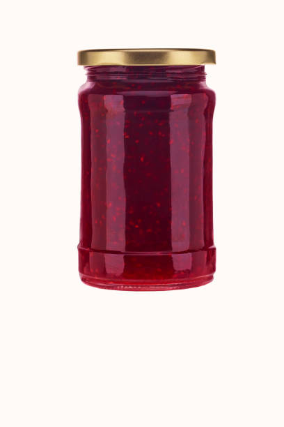 istock Jar of raspberry jam isolated on white background. 1815245755