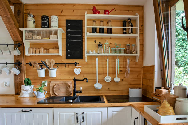 istock Interior of kitchen in cottage with kitchen utensil. Home decor with wood design. Rustic decoration. 1815257076