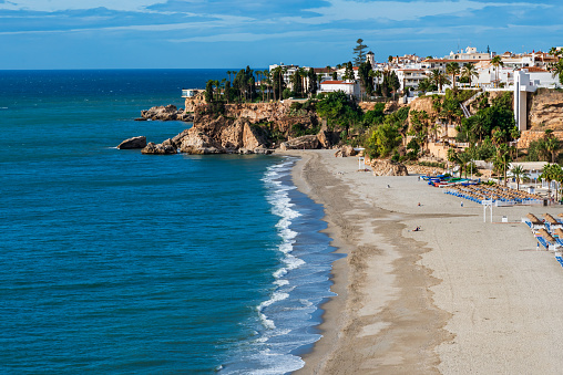 Burriana beach with the Balcón de Europa and part of the old town of Nerja in the background