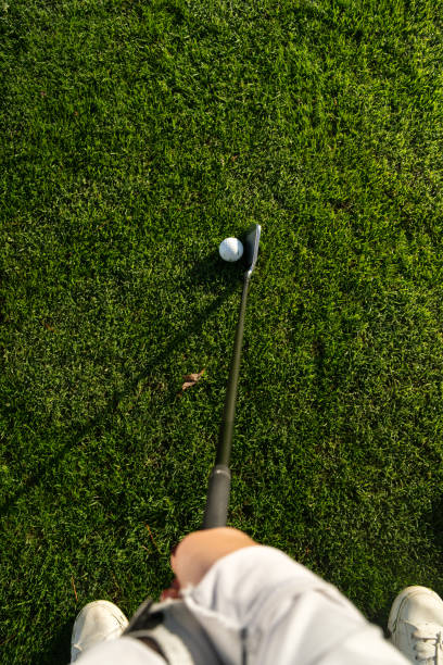 istock A golfer about to hit a golf ball 1815263903