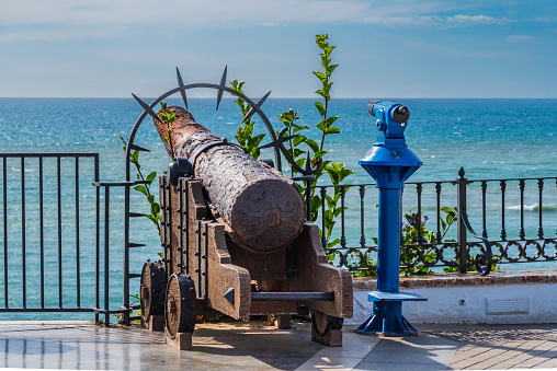 Decorative cannon at the Balcon de Europa viewpoint with views of the Mediterranean Sea, Nerja.